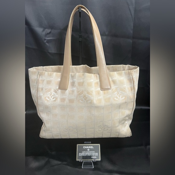 CHANEL Handbags - Chanel Canvas Tote w/ Authenticity card & Sticker